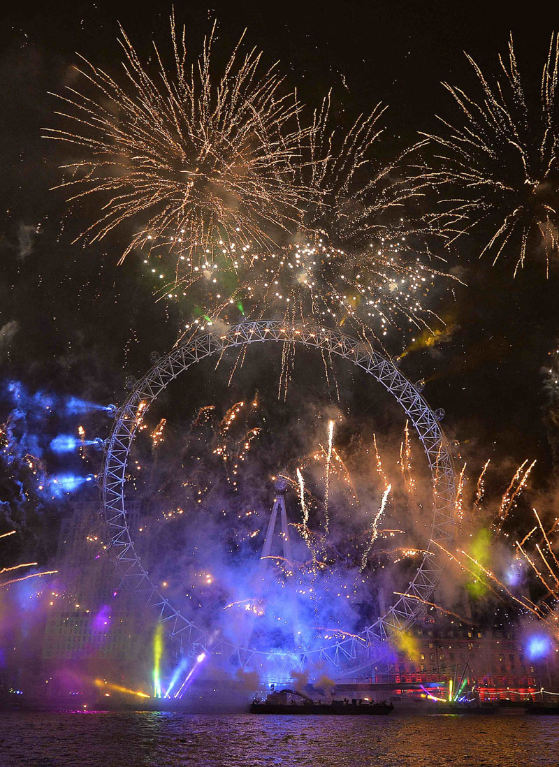 Fireworks explode around the London Eye whe