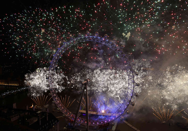 Fireworks explode around the London Eye whe