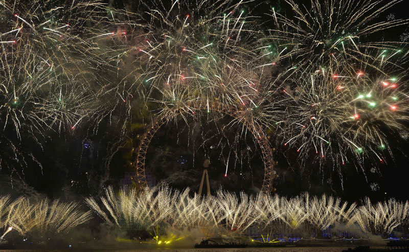 Fireworks explode around the London Eye whe