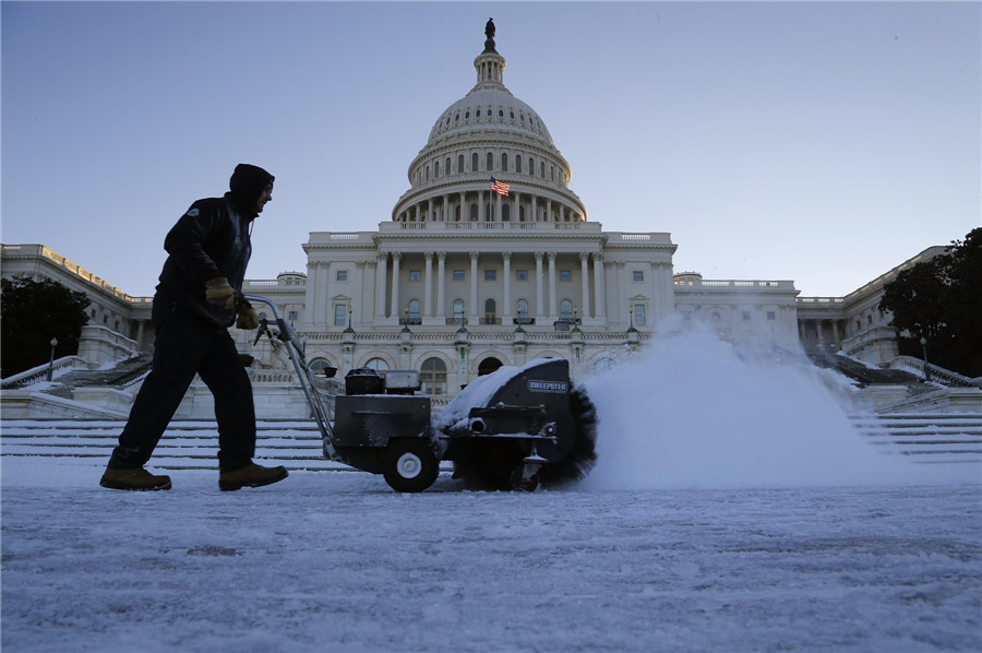 Bitter cold lingers as NE US digs out from snow
