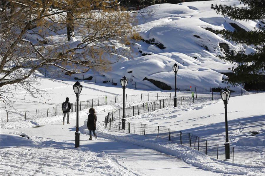 Bitter cold lingers as NE US digs out from snow