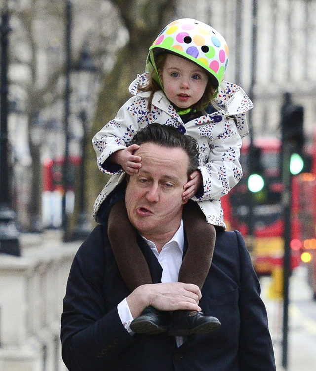 Cameron walks his daughter to nursery school