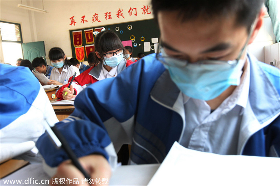 Mask-wearing students protest industrial waste gas