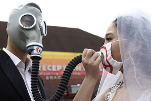 Mask-wearing students protest industrial waste gas