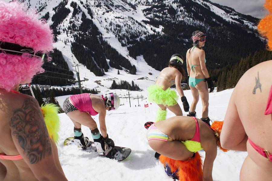 Skiing and snowboarding in bikinis and shorts