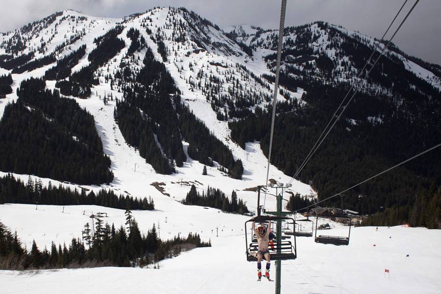 Skiing and snowboarding in bikinis and shorts