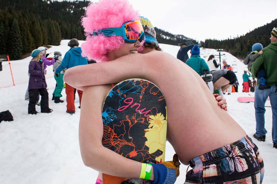 Skiing and snowboarding in bikinis and shorts