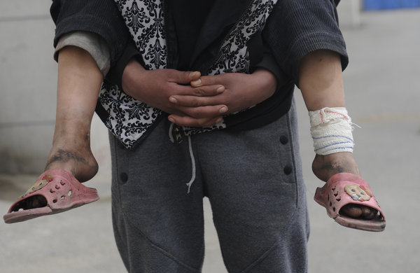 Street children live in hole in a wall in NE China