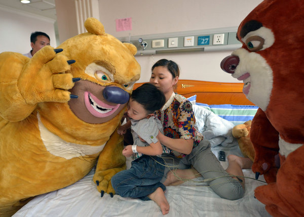 Cartoon characters visit brain tumor boy