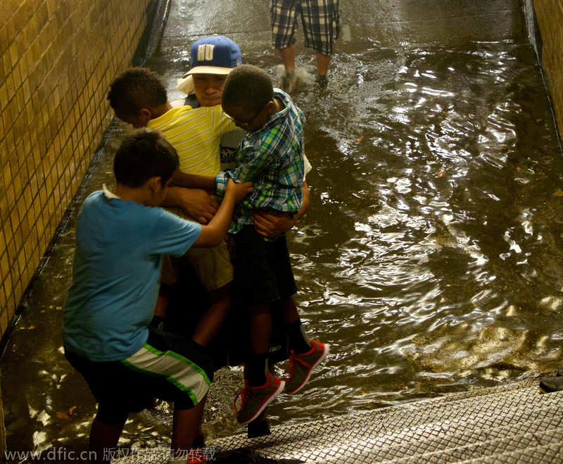 Heavy rain, floods swamp NYC metro stations