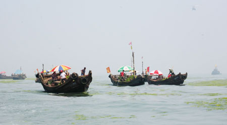 Algae cleared, Olympic sailors begin to practise normally in Qingdao