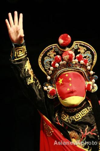 Opera performer demonstrates face-changing stunt