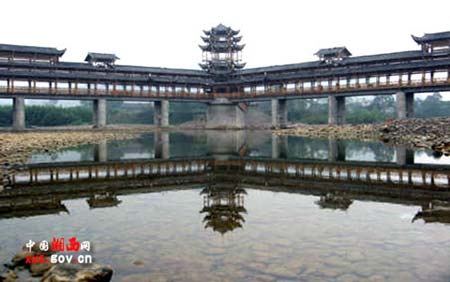Tujia people build longest wind-rain bridge