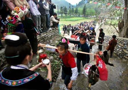 Ethnic Miao people celebrate Guzang Festival