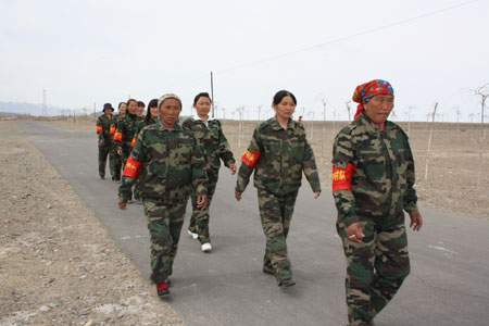 Xinjiang Hebukesaier's all-woman village patrol strut their stuff