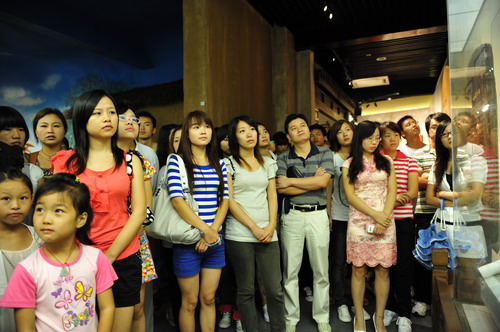 Visitors absorbed by the exhibits