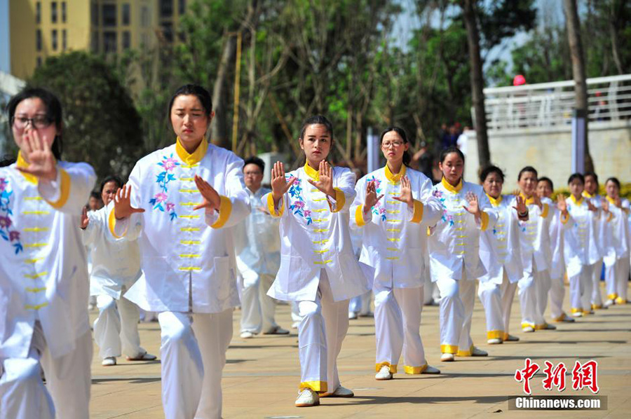 Hundreds of people practice tai chi in spring