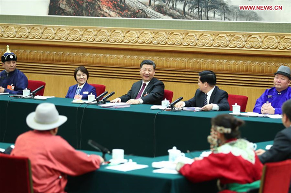 Xi stresses poverty alleviation in talk with delegates