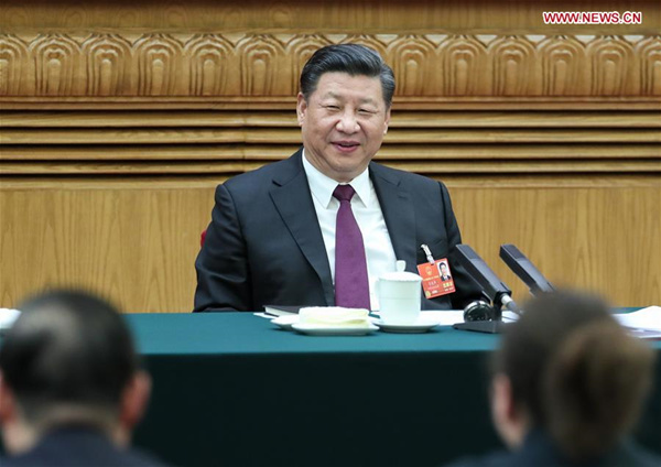 Xi stresses poverty alleviation in talk with delegates
