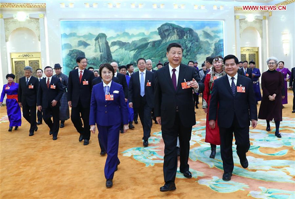 Xi stresses poverty alleviation in talk with delegates
