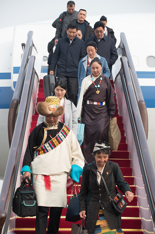 Deputies to 13th NPC arrive in Beijing