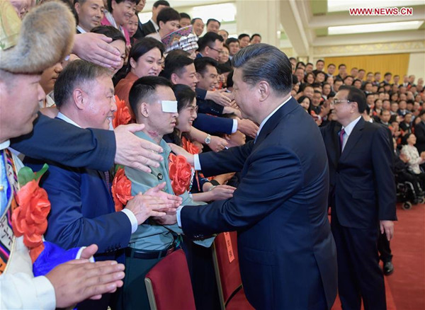 Xi meets role models with disabilities, their outstanding supporters