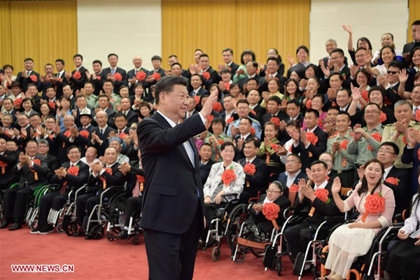 Xi meets role models with disabilities, their outstanding supporters