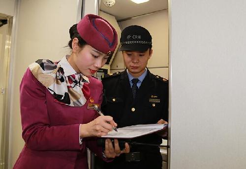 Attendants work in a standby bullet train