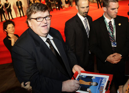 U.S. director Moore and his wife on the red carpet at the 66th Venice Film Festival