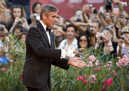 George Clooney and his girlfriend on red carpet at 66th Venice Film Festival