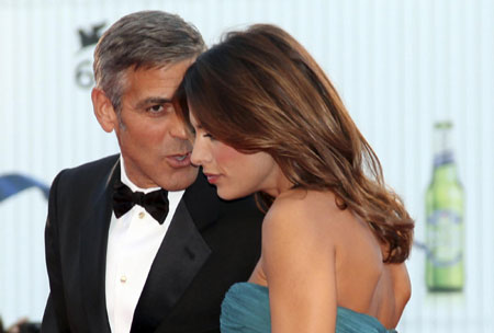 George Clooney and his girlfriend on red carpet at 66th Venice Film Festival
