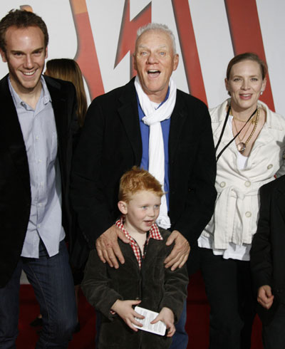 Cyrus, Travolta pose at the premiere animated film 
