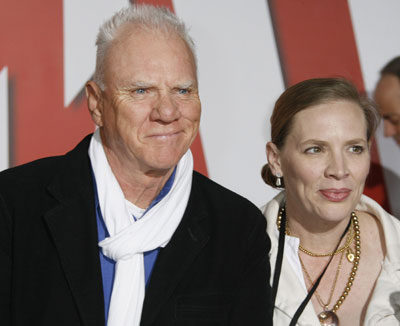 Cyrus, Travolta pose at the premiere animated film 
