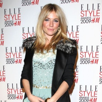Sienna Miller burns breasts