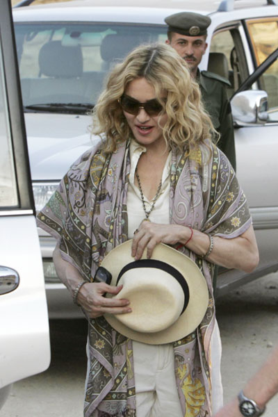 Madonna shoes offered to Gypsy charity in Romania