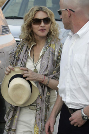 Madonna shoes offered to Gypsy charity in Romania