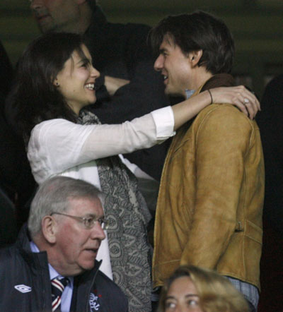 Cruise, Holmes, and Diaz watch a football match