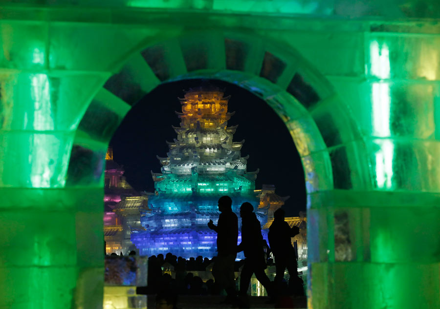 Ice sculptures shine at night in Harbin