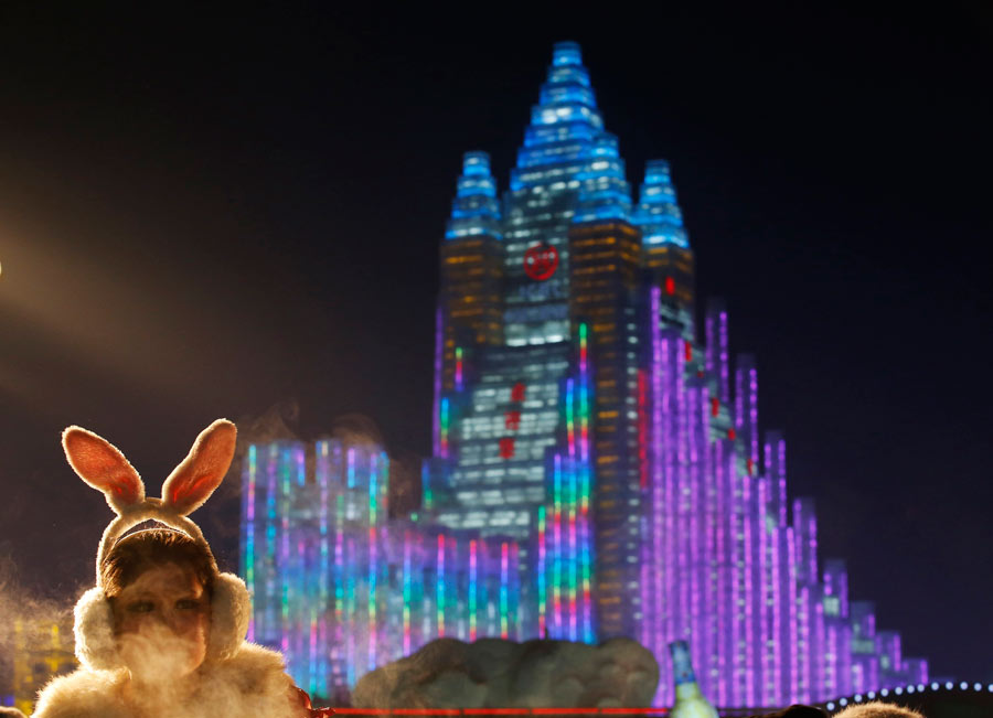Ice sculptures shine at night in Harbin