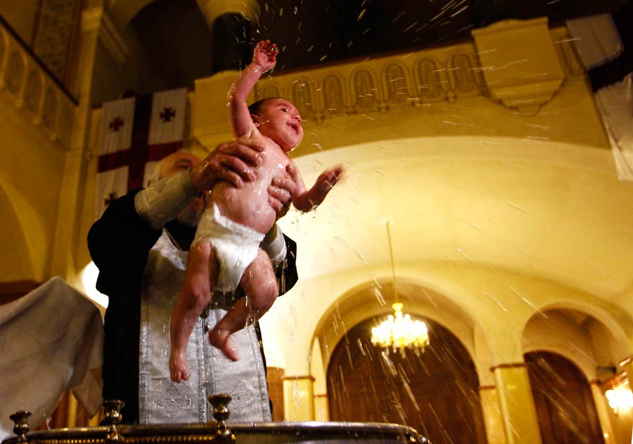 Babies baptized during a mass ceremony