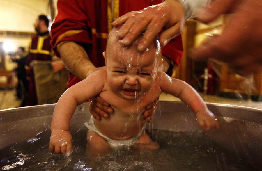 Babies baptized during a mass ceremony