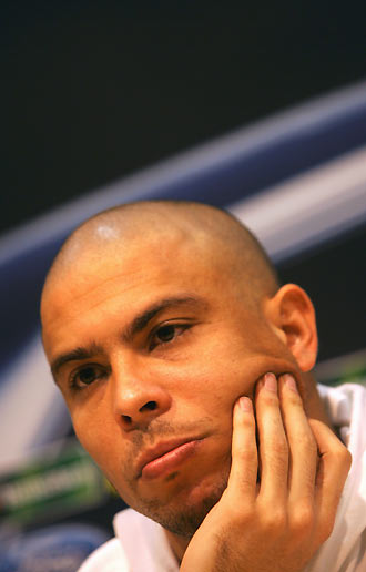 Real Madrid's Ronaldo from Brazil ponders on a question during a news conference at Santiago Bernabeu stadium in Madrid February 20, 2006. Ronaldo hinted on Monday he would leave Real Madrid at the end of the season because of a lack of support from fans at the Bernabeu. Real Madrid will face Arsenal at Champions League first knock-out round first leg match on February 21, 2006. [Reuters]