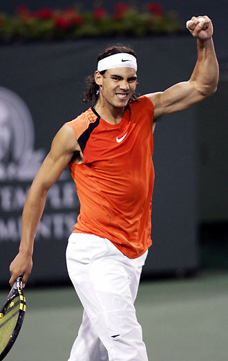 Rafael Nadal of Spain celebrates his victory over Marcos Baghdatis of Cyprus at the Pacific Life Open tennis tournament in Indian Wells, California March 17, 2006. 