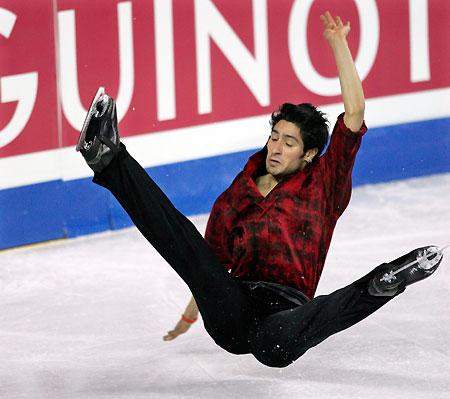 Canada's Emanuel Sandhu falls while performing at the World Figure Skating Championships in Calgary, Canada, March 21, 2006. 