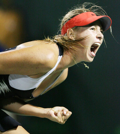 Maria Sharapova of Russia reacts during her semi-final match against Tatiana Golovin of France at the Nasdaq-100 Open tennis tournament in Key Biscayne, Florida March 30, 2006.