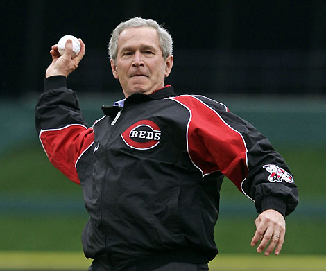 U.S. President George W. Bush delivers the first pitch at the Cincinnati Reds baseball team's home opening game of the season in Cincinnati, Ohio April 3, 2006. Bush watched the opening innings of the Red's game against the Chicago Cubs. [Reuters]