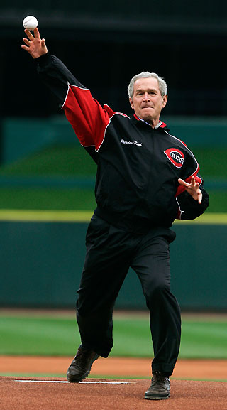 U.S. President George W. Bush delivers the first pitch at the Cincinnati Reds baseball team's home opening game of the season in Cincinnati, Ohio April 3, 2006. Bush watched the opening innings of the Red's game against the Chicago Cubs. [Reuters]