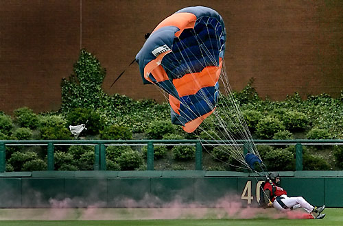 A member of the United States Falling Angels skydiving team loses control in the outfield before the start of the baseball game between the Phillies and St Louis Cardinals on opening day in Philadelphia, Pennsylvania April 3, 2006. [Reuters]