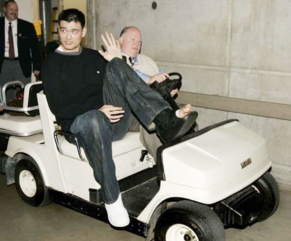 Houston Rockets
center Yao Ming, of China, is driven from the arena locker room by security director Al Higham after his NBA basketball game against the Utah Jazz on Monday, April 10, 2006, in Salt Lake City. Yao broke his left foot in the first quarter. The Jazz beat the Rockets, 85-83. (AP