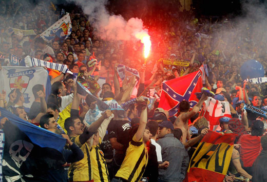 Zaragoza supporters light flares during the King's Cup final soccer match against Espanyol at Madrid's Santiago Bernabeu stadium, 
